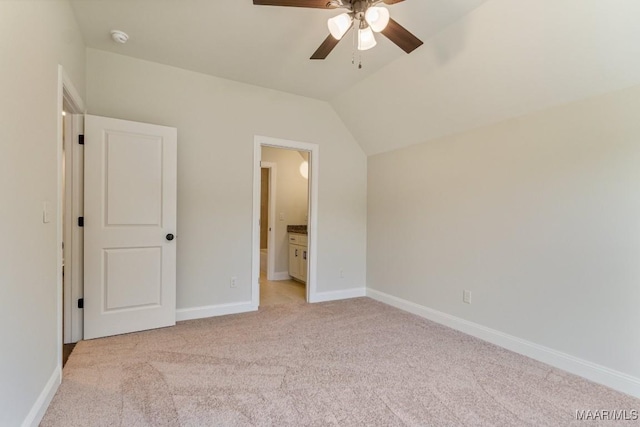 79 Birchwood Ln, Wetumpka, AL 36093 - unfurnished bedroom featuring light colored carpet, vaulted ceiling, ensuite bathroom, and ceiling fan