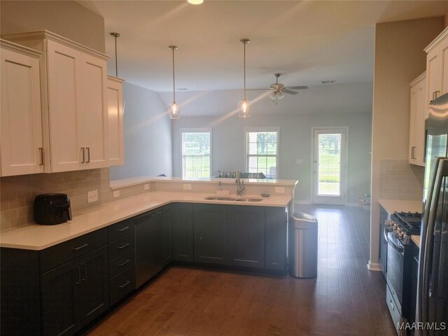 512 Lismore Pl, Montgomery, AL 36117 - kitchen featuring black gas range oven, a peninsula, dark wood finished floors, a ceiling fan, and white cabinets