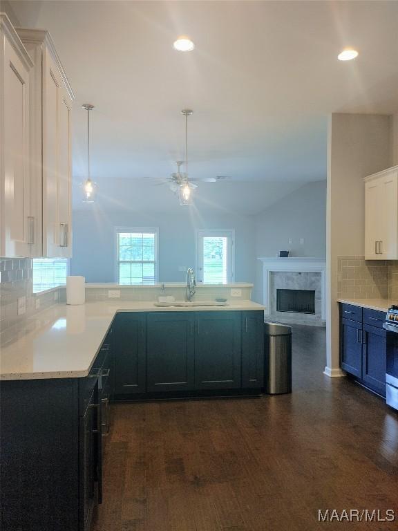 512 Lismore Pl, Montgomery, AL 36117 - kitchen with tasteful backsplash, dark wood-type flooring, light countertops, ceiling fan, and white cabinets