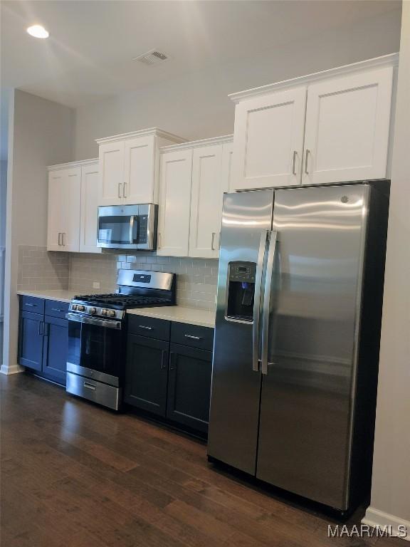 512 Lismore Pl, Montgomery, AL 36117 - kitchen with stainless steel appliances, white cabinetry, light countertops, and backsplash