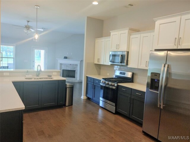 512 Lismore Pl, Montgomery, AL 36117 - kitchen with stainless steel appliances, ceiling fan, white cabinetry, light countertops, and dark wood-style floors