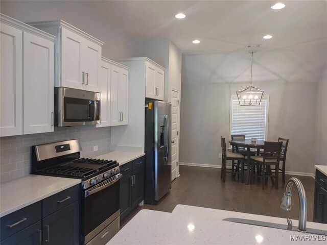 512 Lismore Pl, Montgomery, AL 36117 - kitchen featuring stainless steel appliances, white cabinetry, decorative backsplash, dark wood finished floors, and recessed lighting