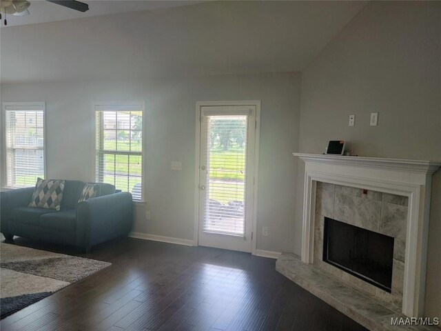 512 Lismore Pl, Montgomery, AL 36117 - living room with a tiled fireplace, dark wood finished floors, plenty of natural light, and a ceiling fan