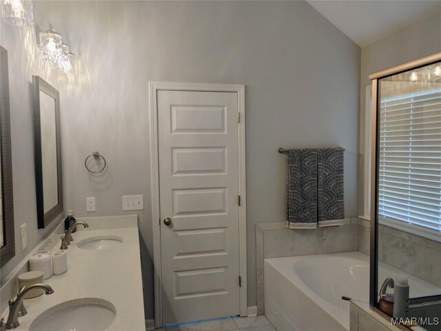 512 Lismore Pl, Montgomery, AL 36117 - full bathroom featuring a bath, double vanity, and tile patterned flooring