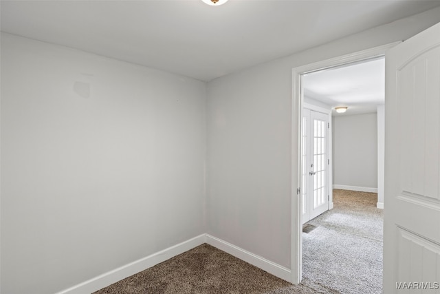 1310 Woodward Ave, Montgomery, AL 36106 - spare room with dark colored carpet and baseboards