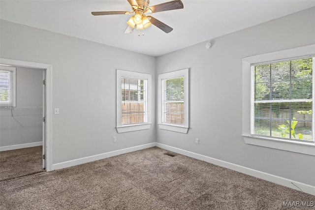 1310 Woodward Ave, Montgomery, AL 36106 - carpeted empty room featuring baseboards and a ceiling fan