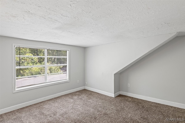 1310 Woodward Ave, Montgomery, AL 36106 - spare room with a textured ceiling and carpet