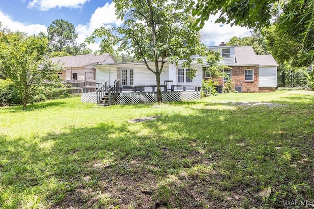 1310 Woodward Ave, Montgomery, AL 36106 - view of grassy yard with a deck and french doors