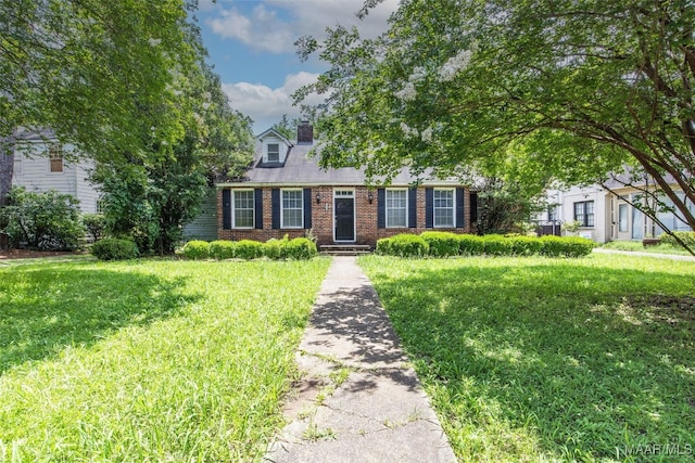1310 Woodward Ave, Montgomery, AL 36106 - view of front of home with brick siding, a chimney, and a front yard