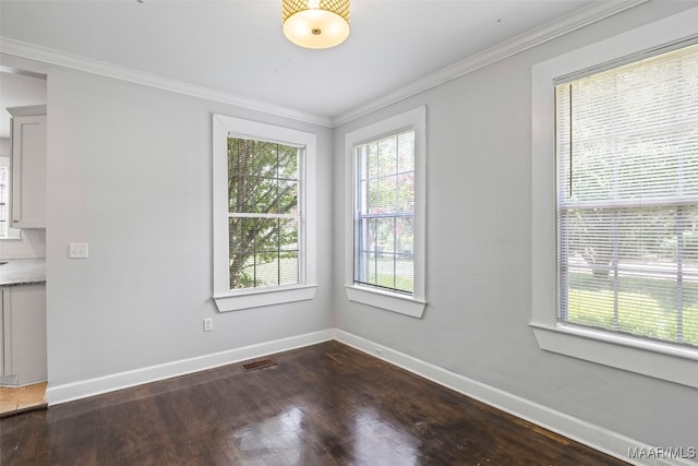 1310 Woodward Ave, Montgomery, AL 36106 - unfurnished dining area featuring dark wood-style floors and ornamental molding