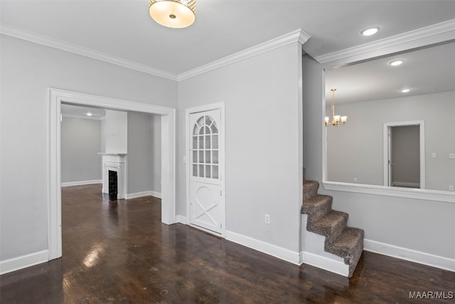 1310 Woodward Ave, Montgomery, AL 36106 - empty room with crown molding, a chandelier, wood finished floors, stairs, and a fireplace with flush hearth