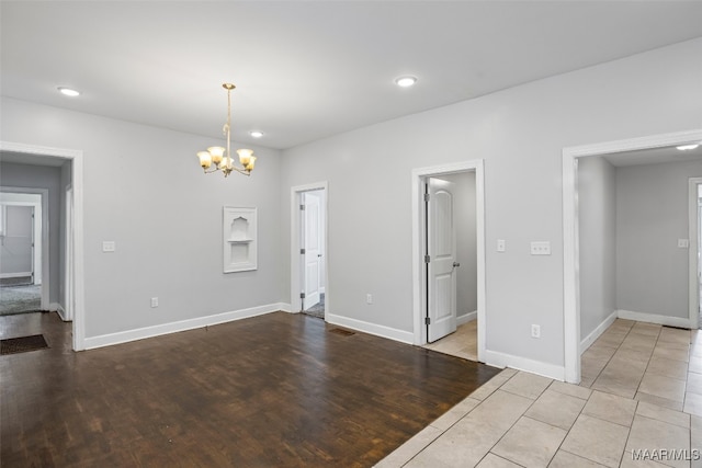 1310 Woodward Ave, Montgomery, AL 36106 - unfurnished room with a chandelier, recessed lighting, and wood finished floors