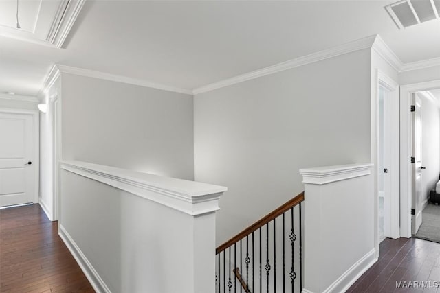 8465 Melbourne Cir, Montgomery, AL 36117 - hallway featuring an upstairs landing, dark wood finished floors, attic access, and ornamental molding