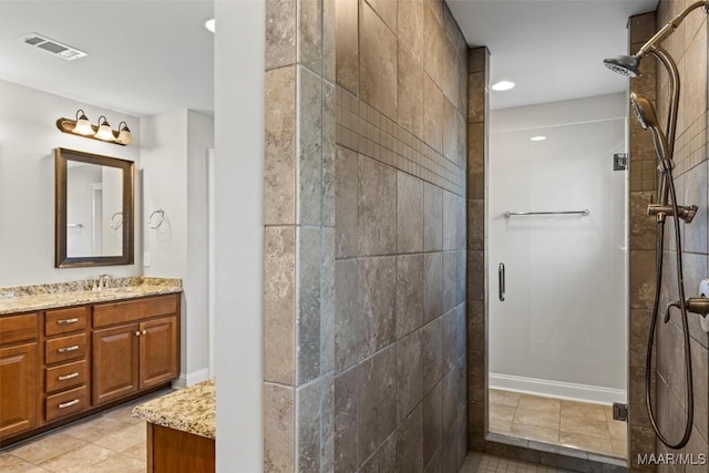 8465 Melbourne Cir, Montgomery, AL 36117 - bathroom featuring a shower stall, vanity, recessed lighting, and tile patterned flooring
