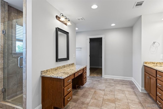 8465 Melbourne Cir, Montgomery, AL 36117 - full bath featuring vanity, a stall shower, recessed lighting, and a spacious closet