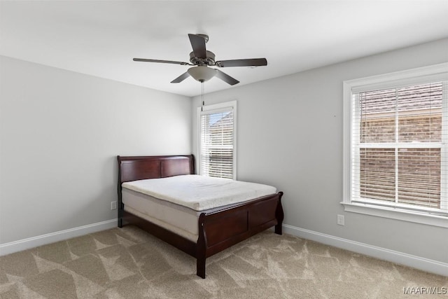 8465 Melbourne Cir, Montgomery, AL 36117 - carpeted bedroom with multiple windows and a ceiling fan