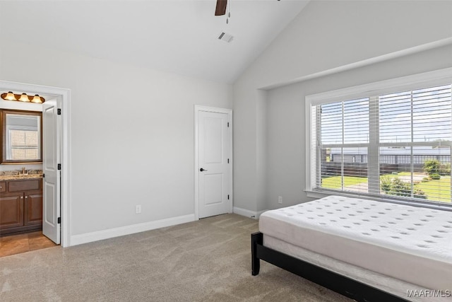 8465 Melbourne Cir, Montgomery, AL 36117 - bedroom featuring light carpet, lofted ceiling, ensuite bath, and ceiling fan