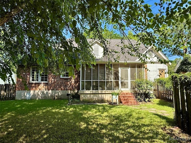 3319 Lexington Rd, Montgomery, AL 36106 - back of house with a sunroom and brick siding