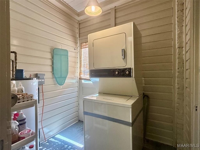 3319 Lexington Rd, Montgomery, AL 36106 - washroom with stacked washer / dryer and wooden walls
