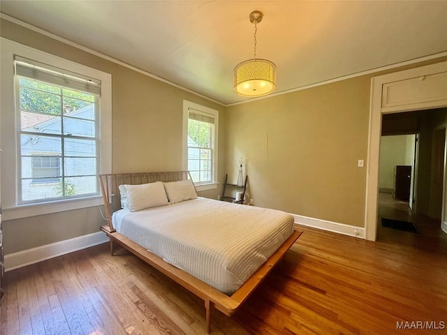3319 Lexington Rd, Montgomery, AL 36106 - bedroom with multiple windows, crown molding, and hardwood / wood-style flooring