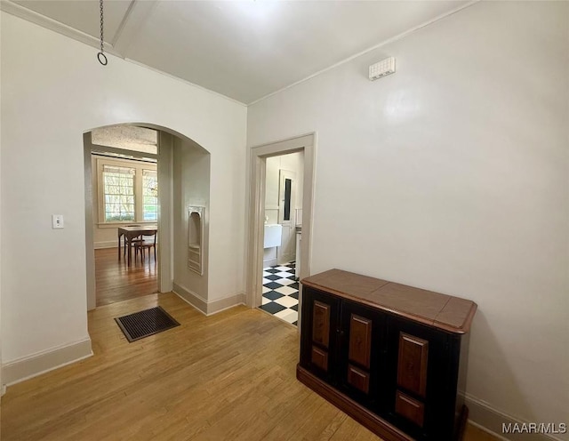 3319 Lexington Rd, Montgomery, AL 36106 - corridor featuring arched walkways and light wood-style flooring