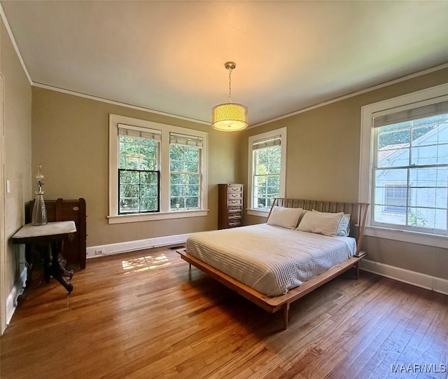 3319 Lexington Rd, Montgomery, AL 36106 - bedroom with multiple windows, wood-type flooring, and crown molding