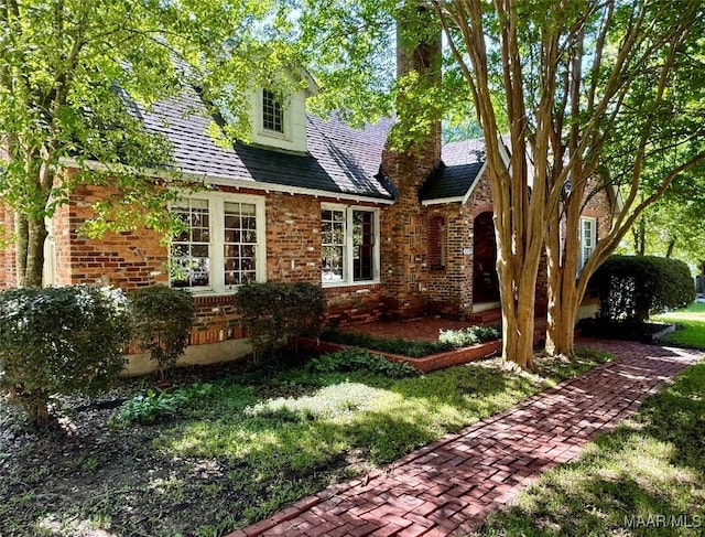 3319 Lexington Rd, Montgomery, AL 36106 - view of front facade featuring brick siding, a chimney, and a front lawn