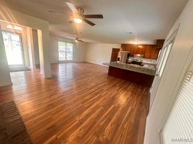 508 Columbus Dr, Selma, AL 36701 - unfurnished living room with wood finished floors and a ceiling fan