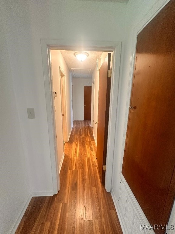 508 Columbus Dr, Selma, AL 36701 - hallway with light wood finished floors and attic access