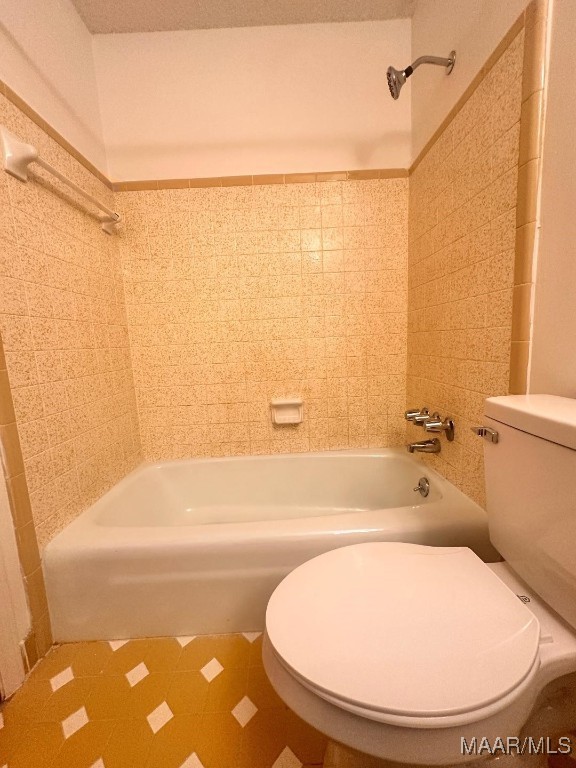 508 Columbus Dr, Selma, AL 36701 - bathroom with  shower combination and tile patterned floors