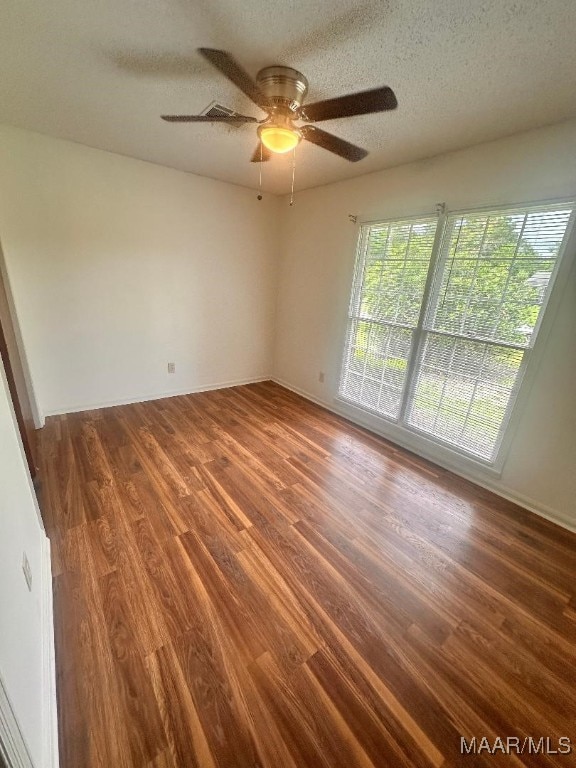 508 Columbus Dr, Selma, AL 36701 - empty room featuring wood finished floors, a textured ceiling, and ceiling fan