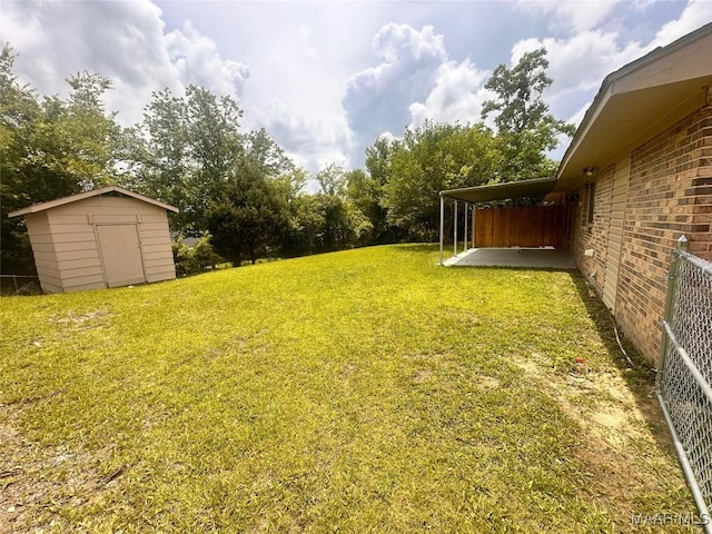 508 Columbus Dr, Selma, AL 36701 - view of green lawn featuring a storage shed