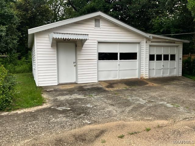 158 S Madison Ter, Montgomery, AL 36107 - detached garage with view of wooded area