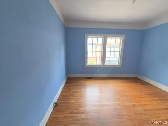 158 S Madison Ter, Montgomery, AL 36107 - unfurnished room featuring baseboards and wood finished floors