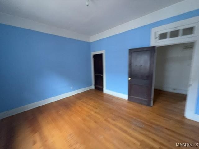 158 S Madison Ter, Montgomery, AL 36107 - unfurnished bedroom with light wood-style floors and baseboards