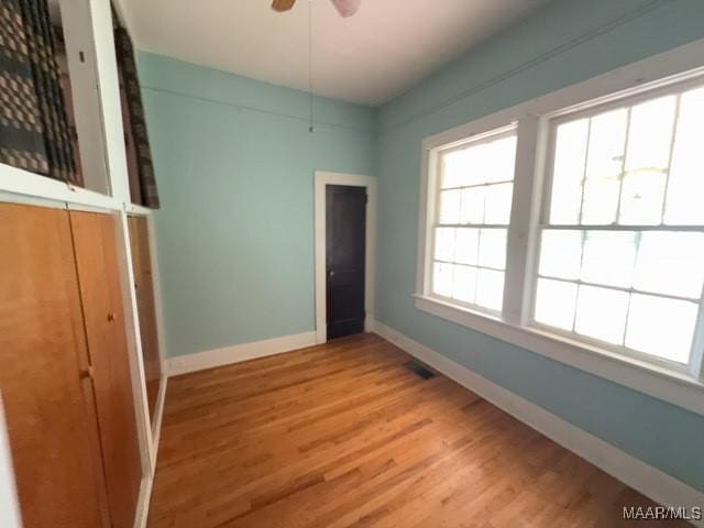 158 S Madison Ter, Montgomery, AL 36107 - unfurnished bedroom featuring baseboards and light wood-style floors