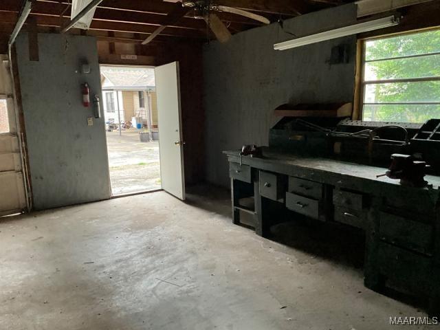 158 S Madison Ter, Montgomery, AL 36107 - kitchen with unfinished concrete floors, open shelves, and ceiling fan
