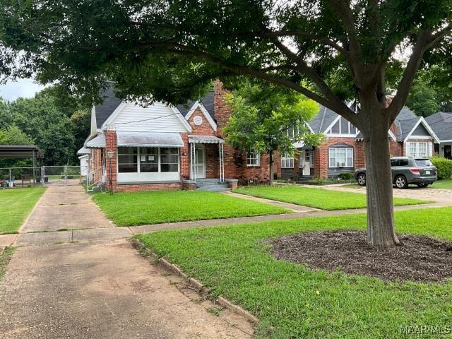 158 S Madison Ter, Montgomery, AL 36107 - view of front of home with brick siding and a front yard