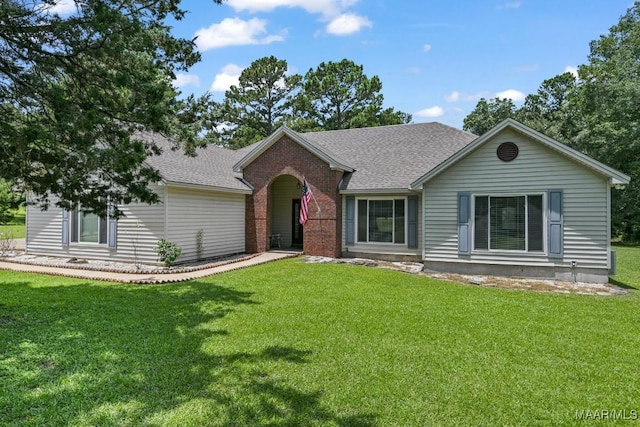 165 Ten Cedars Dr, Titus, AL 36080 - ranch-style house with a front yard, roof with shingles, and brick siding