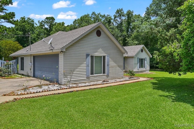 165 Ten Cedars Dr, Titus, AL 36080 - ranch-style house with concrete driveway, a front lawn, a garage, and a shingled roof