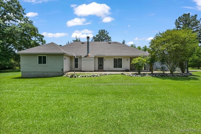 165 Ten Cedars Dr, Titus, AL 36080 - rear view of house featuring a patio area, a lawn, and roof with shingles