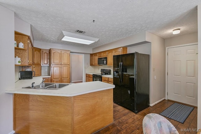 165 Ten Cedars Dr, Titus, AL 36080 - kitchen with black appliances, dark wood-style flooring, a peninsula, light countertops, and open shelves