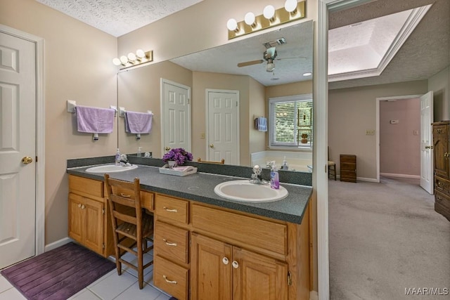 165 Ten Cedars Dr, Titus, AL 36080 - bathroom with double vanity, ceiling fan, and a textured ceiling