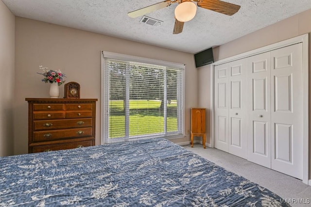 165 Ten Cedars Dr, Titus, AL 36080 - bedroom featuring carpet floors, a textured ceiling, a ceiling fan, and a closet