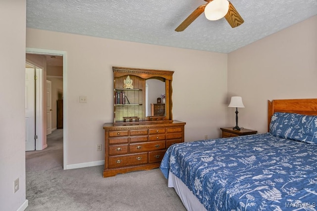 165 Ten Cedars Dr, Titus, AL 36080 - carpeted bedroom featuring a textured ceiling and a ceiling fan