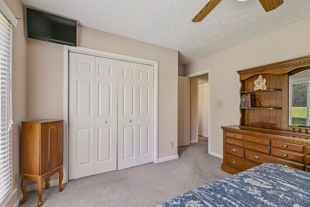 165 Ten Cedars Dr, Titus, AL 36080 - bedroom featuring carpet, a closet, a ceiling fan, and a textured ceiling