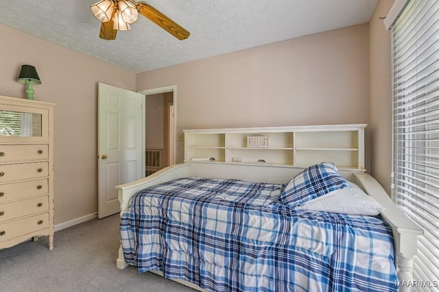 165 Ten Cedars Dr, Titus, AL 36080 - bedroom with carpet flooring, multiple windows, a ceiling fan, and a textured ceiling
