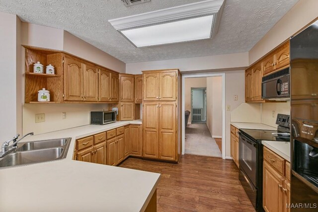 165 Ten Cedars Dr, Titus, AL 36080 - kitchen with black appliances, dark wood-style floors, open shelves, a textured ceiling, and light countertops