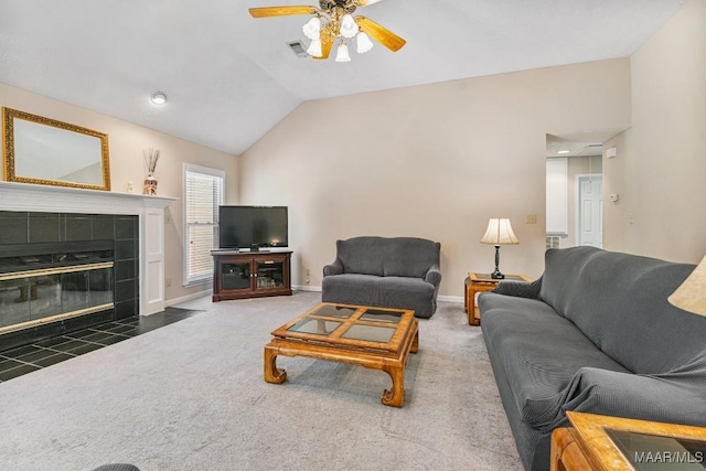 165 Ten Cedars Dr, Titus, AL 36080 - carpeted living room featuring vaulted ceiling, a ceiling fan, and a fireplace