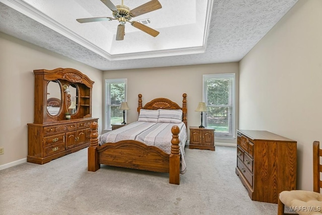 165 Ten Cedars Dr, Titus, AL 36080 - bedroom with a tray ceiling, multiple windows, light colored carpet, and a textured ceiling